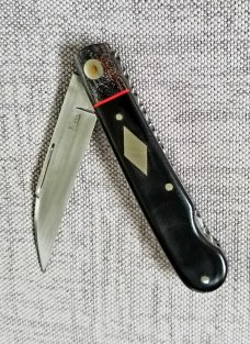 K'roo Custom Swayback Lockback W/ slip, 4" closeD micarta, spacers and liners filework K'roo Custom Swayback Lockback W/ slip, 4" closeD micarta, spacers and liners filework