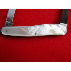 VINTAGE MOTHER OF PEARL SWELLEND SERPENTINE SLEEVEBOARD NEW YORK KNIFE CO. 1856-1931 VINTAGE MOTHER OF PEARL SWELLEND SERPENTINE SLEEVEBOARD NEW YORK KNIFE CO. 1856-1931