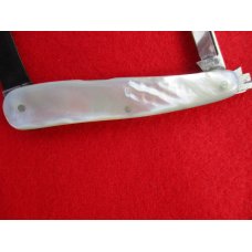 VINTAGE MOTHER OF PEARL SWELLEND SERPENTINE SLEEVEBOARD NEW YORK KNIFE CO. 1856-1931 VINTAGE MOTHER OF PEARL SWELLEND SERPENTINE SLEEVEBOARD NEW YORK KNIFE CO. 1856-1931