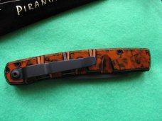 PIRANHA VIRUS / ORANGE & BLACK BLADE - NIB PIRANHA VIRUS / ORANGE & BLACK BLADE - NIB
