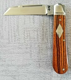Riaan Ras Desert Ironwood Swayback Native.N690..high polish finish..4" clsd..long pull..coa Riaan Ras Desert Ironwood Swayback Native.N690..high polish finish..4" clsd..long pull..coa