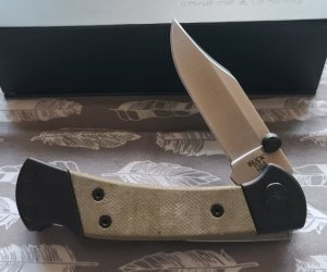 Buck 112 Ranger Sport. Green Canvas Micarta with Black Anodized Aluminum Frame. S30V steel. BNIB