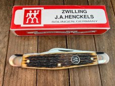 Henckels by Boker 4 Blade Stockman Fossilized Ivory Pin Feather Jigged Henckels by Boker 4 Blade Stockman Fossilized Ivory Pin Feather Jigged