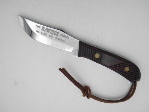 Queen Cutlery Rawhide Series #4190 Fixed Blade Skinning Knife: 9 1/2” overall with a 4 ” blade, 1995