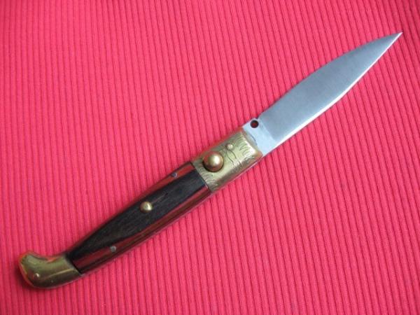 Vintage Italian Indiana Engraved Bolster Button Open/Close Switchblade Knife. Vintage Italian Indiana Engraved Bolster Button Open/Close Switchblade Knife.
