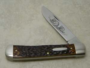 Western USA S-693 D Racoon Etch Jigged Delrin Linerlock 1 Blade Trapper Knife