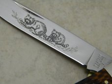 Western USA S-693 D Racoon Etch Jigged Delrin Linerlock 1 Blade Trapper Knife
