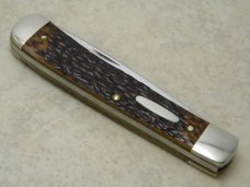 Western USA S-693 D Racoon Etch Jigged Delrin Linerlock 1 Blade Trapper Knife