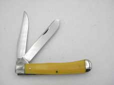 Queen Cutlery #19A Trapper: 4 1/8” closed, circa 1974, etched blade, amber handles Queen Cutlery #19A Trapper: 4 1/8” closed, circa 1974, etched blade, amber handles