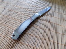 Never Used MOKI Black Pearl knife with leaf inlaid shield