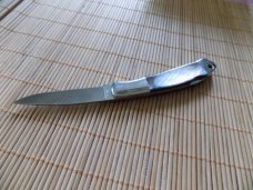 Never Used MOKI Black Pearl knife with leaf inlaid shield