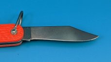 Camillus New York Paratrooper Emergency Rescue Knife. Orange Jigged Delrin Handles, Steel Shackle.