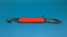 Camillus New York Paratrooper Emergency Rescue Knife. Orange Jigged Delrin Handles, Steel Shackle.
