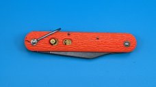 Camillus New York Paratrooper Emergency Rescue Knife. Orange Jigged Delrin Handles, Steel Shackle.