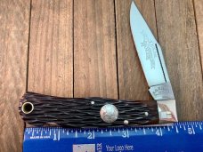 A.G. Russell Mountain Man Lockback 2001 Texas Ranger Commemorative Brown Jigged Bone 154-CM Blade