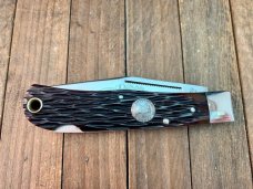 A.G. Russell Mountain Man Lockback 2001 Texas Ranger Commemorative Brown Jigged Bone 154-CM Blade