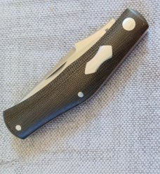 Rhidian Rogue Wave Trapper...OD green canvas micarta. .Cpm154..3.625 cld..red liners..Shield.. slip Rhidian Rogue Wave Trapper...OD green canvas micarta. .Cpm154..3.625 cld..red liners..Shield.. slip