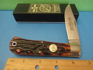 Queen Titusville PA. Amber Carved Stag Bone Mountain Man Pattern # 3