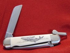 MINT CONDITION CAMILLUS RIGGERS KNIFE HANDLED BY JOE LUIZ SCRIMSHAWED WITH WHALING SCENE WITH COA MINT CONDITION CAMILLUS RIGGERS KNIFE HANDLED BY JOE LUIZ SCRIMSHAWED WITH WHALING SCENE WITH COA