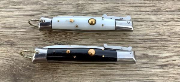 Two Rizzuto s  Imit Pearl and Jet black scales (a matching set} 