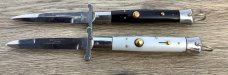 Two Rizzuto s  Imit Pearl and Jet black scales (a matching set} 