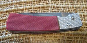 Bigler “98” folding knife, red and holographic silver handle