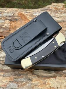 BUCK 110 AUTO BRASS BOLSTER WITH SHEATH & BOX