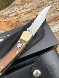 BUCK 110 AUTO BRASS BOLSTER WITH SHEATH & BOX