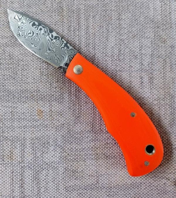 Jeff Pearce Medium Nessie Ultralight..3.5 " closed..Damasteel blade and backspring..Orange G10..coa