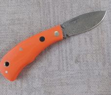 Jeff Pearce Medium Nessie Ultralight..3.5 " closed..Damasteel blade and backspring..Orange G10..coa