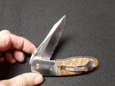 Dual Action EDC hidden release with serrated edge. Dual Action EDC hidden release with serrated edge.