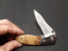 Dual Action EDC hidden release with serrated edge.
