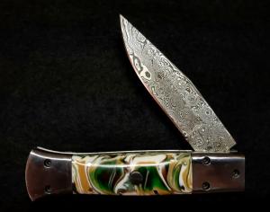 Custom hand made switchblade with Damascus Blade.