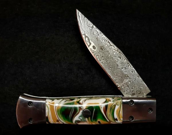 Custom hand made switchblade with Damascus Blade.