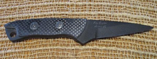 Jay Bigler all-black fixed blade with silver-toned fasteners