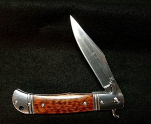 Original CZ Czech Hidden Release knife in rare Snake Wood handles.