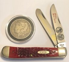 Case xx Silver Dollar Red Bone Trapper and 1900 Morgan Silver Dollar Case xx Silver Dollar Red Bone Trapper and 1900 Morgan Silver Dollar