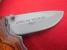 FALKNER AFRICAN WILDLIFE No.1 ELEPHANT WOOD HANDLE ON SS IN BOX COA PRINTED BLADE UNUSED FALKNER AFRICAN WILDLIFE No.1 ELEPHANT WOOD HANDLE ON SS IN BOX COA PRINTED BLADE UNUSED