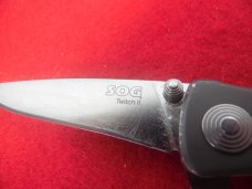 3-1/2" SOG TWITCH II SPRING ASSIST KNIFE IMPORT LIGHTLY USED METAL FRAME 3-1/2" SOG TWITCH II SPRING ASSIST KNIFE IMPORT LIGHTLY USED METAL FRAME