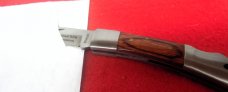 NRA STAINLESS LOCKBACK WOOD SCALES WITH EDGE FROM STORAGE VERY NICE FROM YEARS BACK NRA STAINLESS LOCKBACK WOOD SCALES WITH EDGE FROM STORAGE VERY NICE FROM YEARS BACK