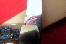 QUEEN CUTLERY CO TITUSVILLE #06L LINER LOCK AMBER BONE TOOL STEEL MINT TEAR DROP JACK YEAR UNKNOWN