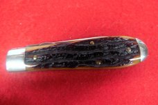 QUEEN CUTLERY CO TITUSVILLE #06L LINER LOCK AMBER BONE TOOL STEEL MINT TEAR DROP JACK YEAR UNKNOWN