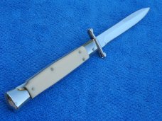 New 9" AKC world Swinguard Ivory- white handles Bayonet blade New 9" AKC world Swinguard Ivory- white handles Bayonet blade