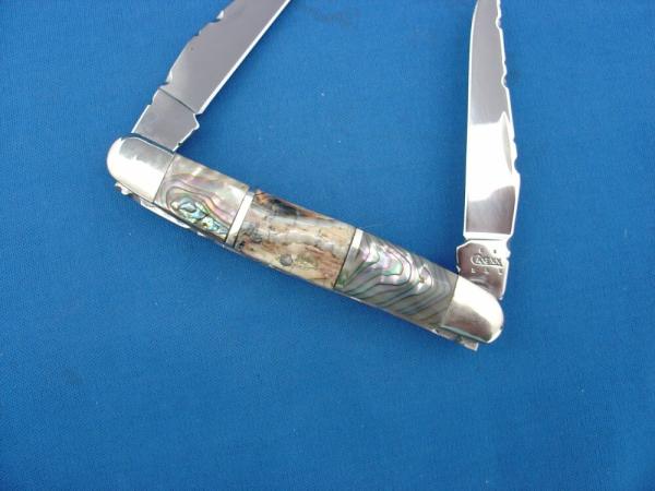 Case XX Sectioned Handle Abalone Pearl & Mammoth Tooth Filed Worked Muskrat Knife Case XX Sectioned Handle Abalone Pearl & Mammoth Tooth Filed Worked Muskrat Knife