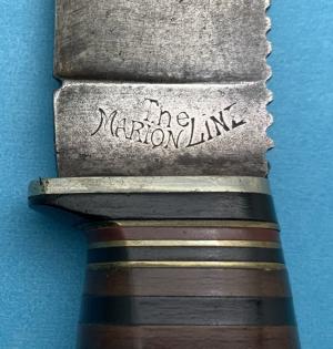 The Marion Line Knife in good, lightly used condition. Leather and brass scales. ..............(TML)