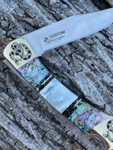 BUCK 110 ** BRIAN YELLOWHORSE CUSTOM RATTLESNAKE MOTHER OF PEARL/ABALONE BRASS BOLSTERS