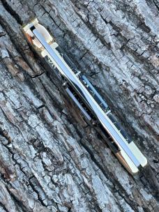 BUCK 110 ** BRIAN YELLOWHORSE CUSTOM RATTLESNAKE MOTHER OF PEARL/ABALONE BRASS BOLSTERS
