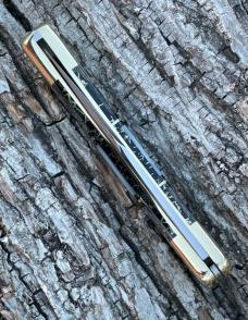 BUCK 110 ** BRIAN YELLOWHORSE CUSTOM RATTLESNAKE MOTHER OF PEARL/ABALONE BRASS BOLSTERS
