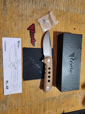 REATE PL-XF. Drop Point Blade. Tan G10 Handle. Quality crafted knife. Good weight very smoot