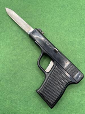 Out The Front Switchblade Gun